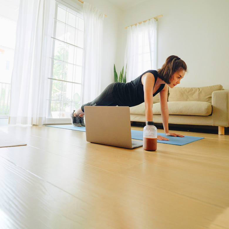 A person doing a virtual yoga class.