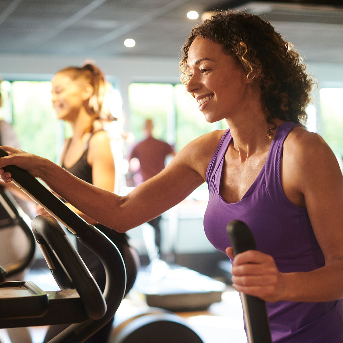 Women on elliptical machines.